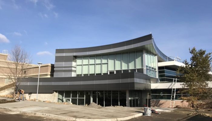 Royal Tyrell Museum a building with a parking lot