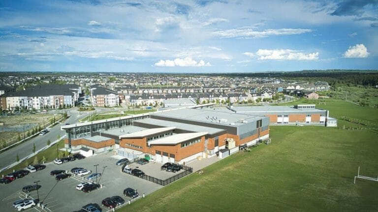 a large body of water with a city in the background