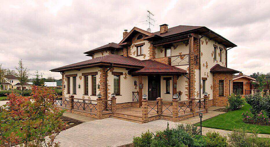 Fatada cu tencuiala decorativa Caparol si elemente din piatra naturala