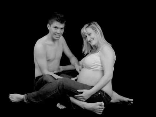 Find the Fertility Clinic That’s Right For You pregnant woman with her man in black and white