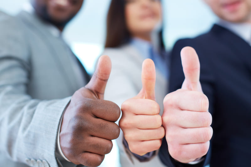 close-up-executives-showing-thumbs-up (1) (1) (1)