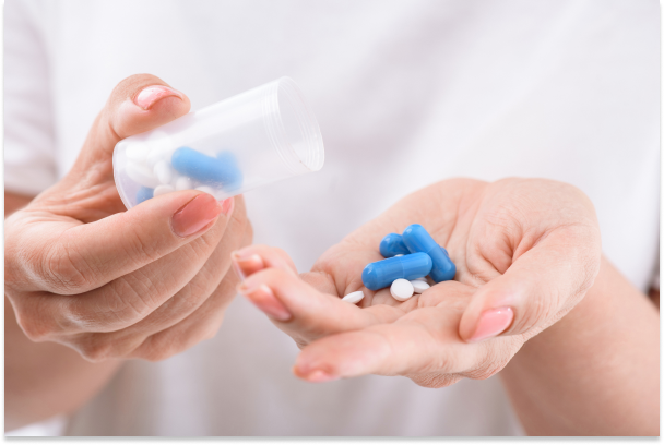 Pharmacist reviewing prescription for Patient Assistance Programs