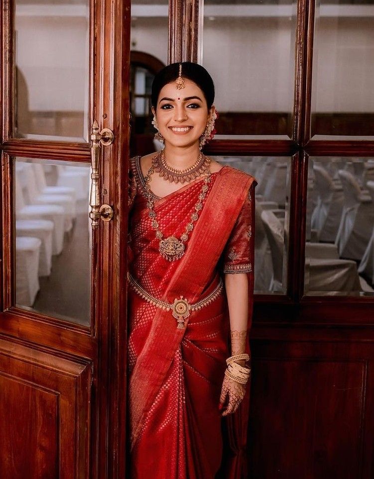 The Classic High Bun with Kerala Bridal Makeup