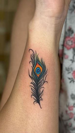 Feather Tattoo on Wrist with Flowers