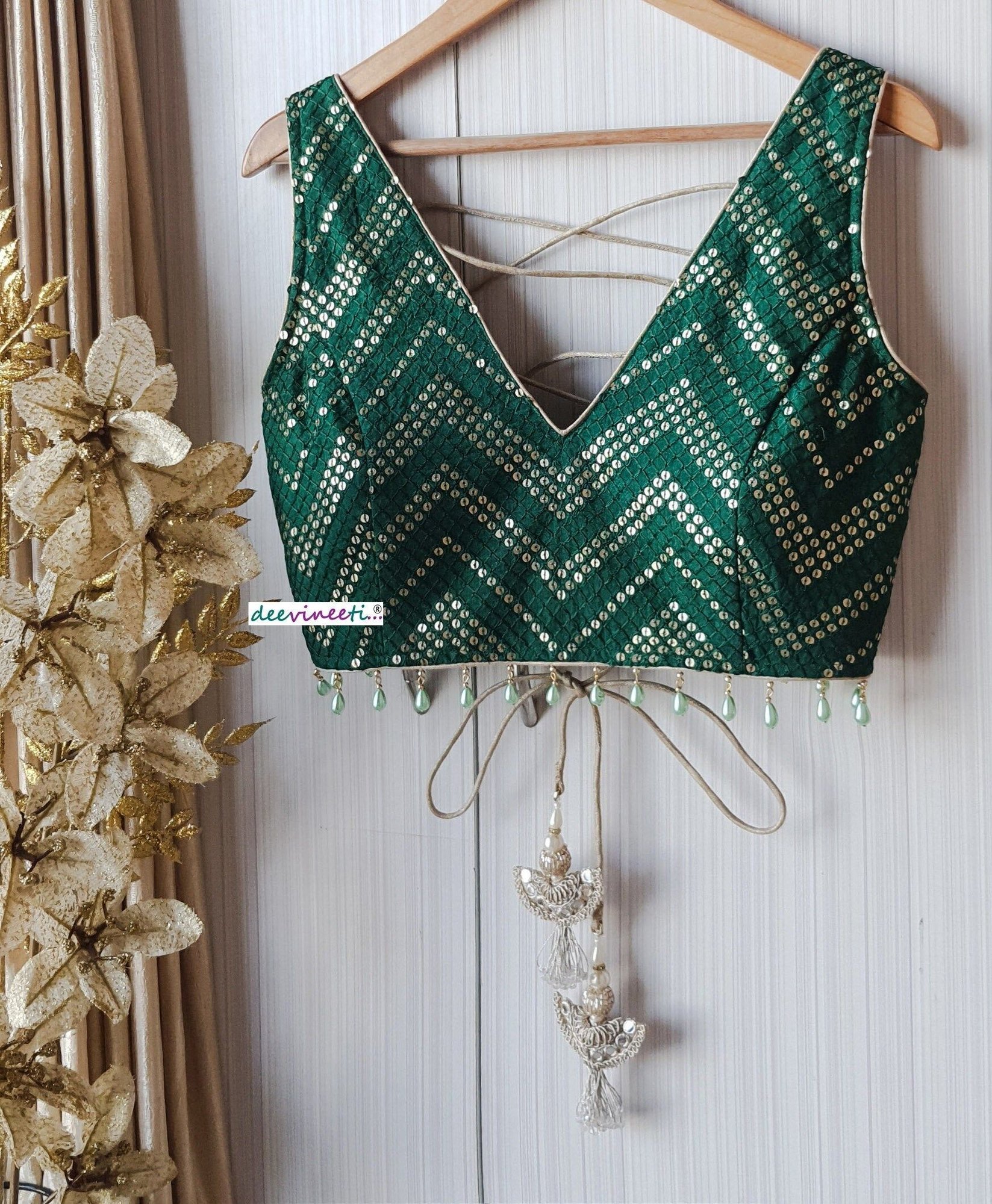 The Deep V-neck Sleeveless Blouse Design Idea