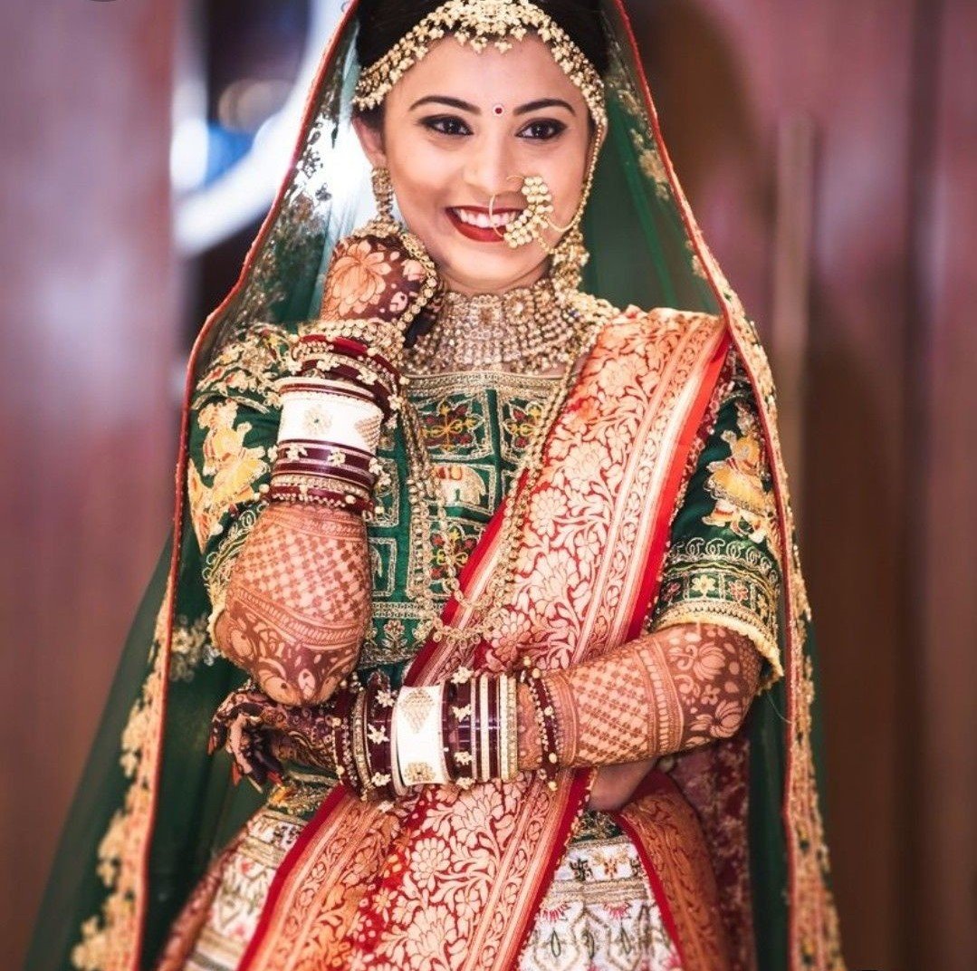 The Lacy Red and Green Bridal Lehenga