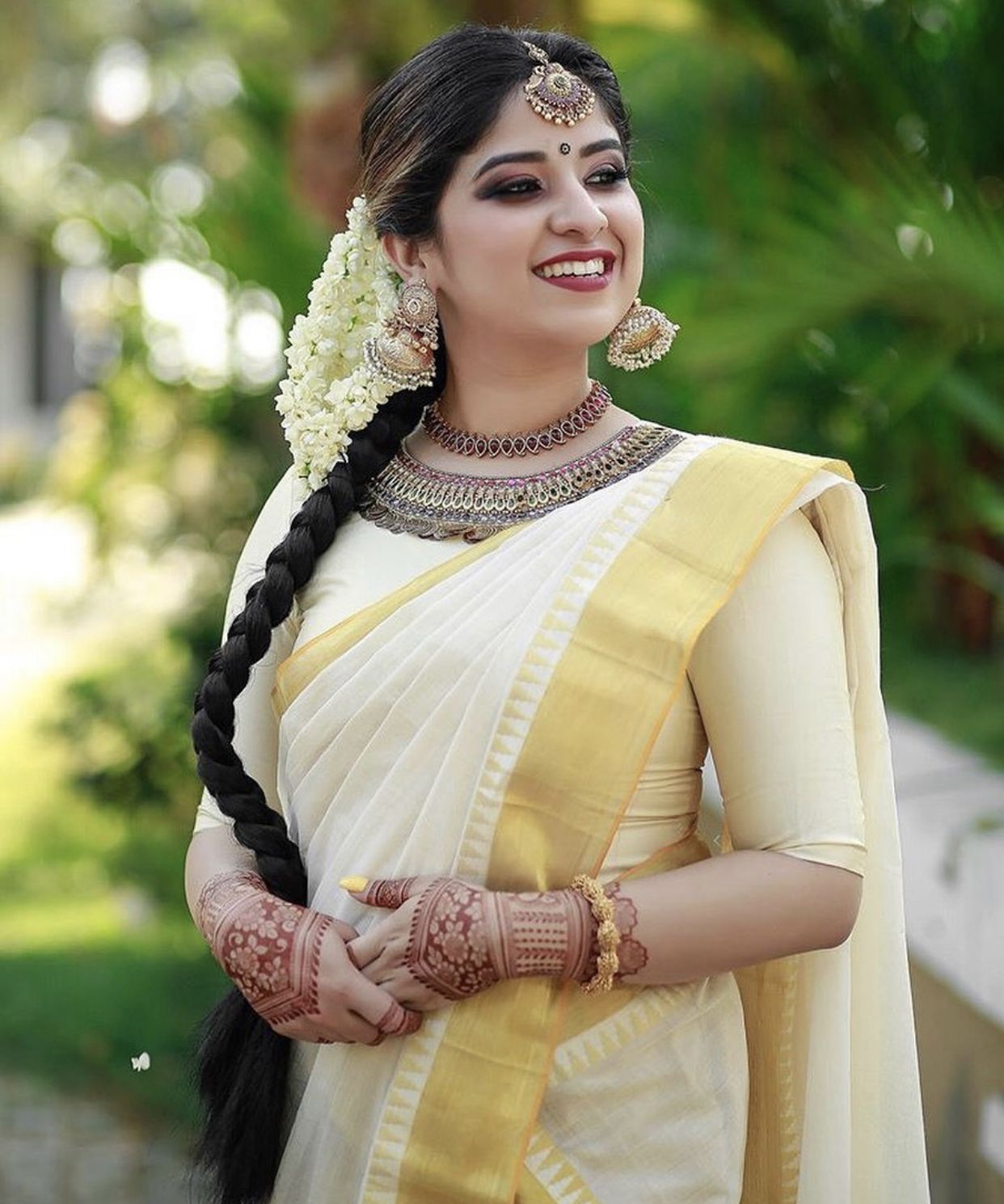 Kerala Bridal Makeup Open hair with Fresh Flowers