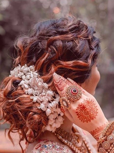 White Bun Hairstyle with Jasmine Flower
