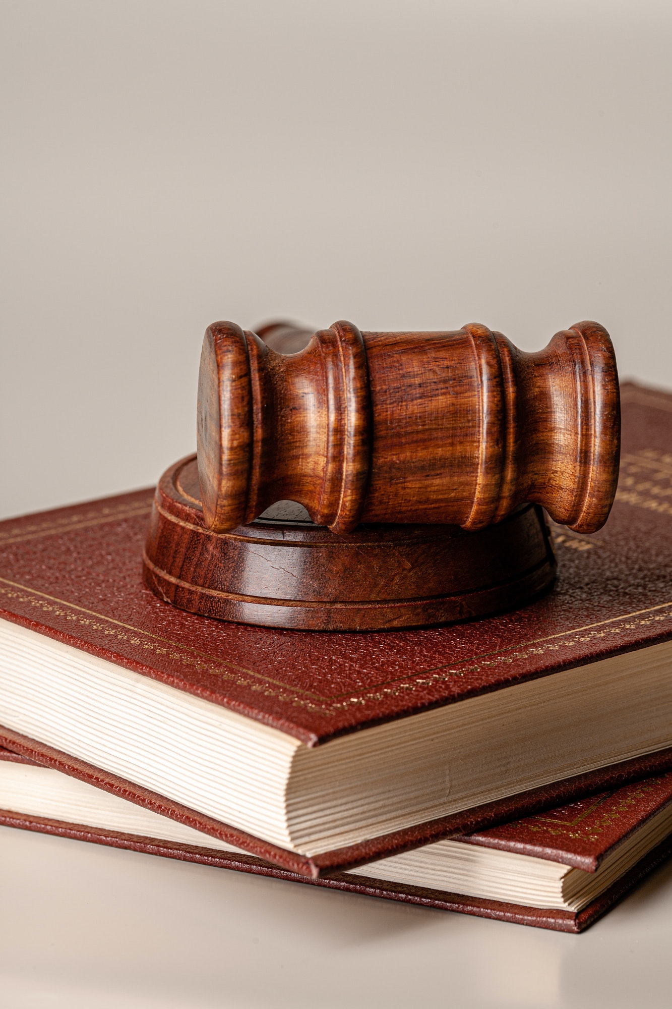 Judge gavel and legal book close up on table
