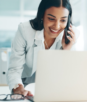 Phone call, laptop and business Indian woman in office for planning, discussion and communication.