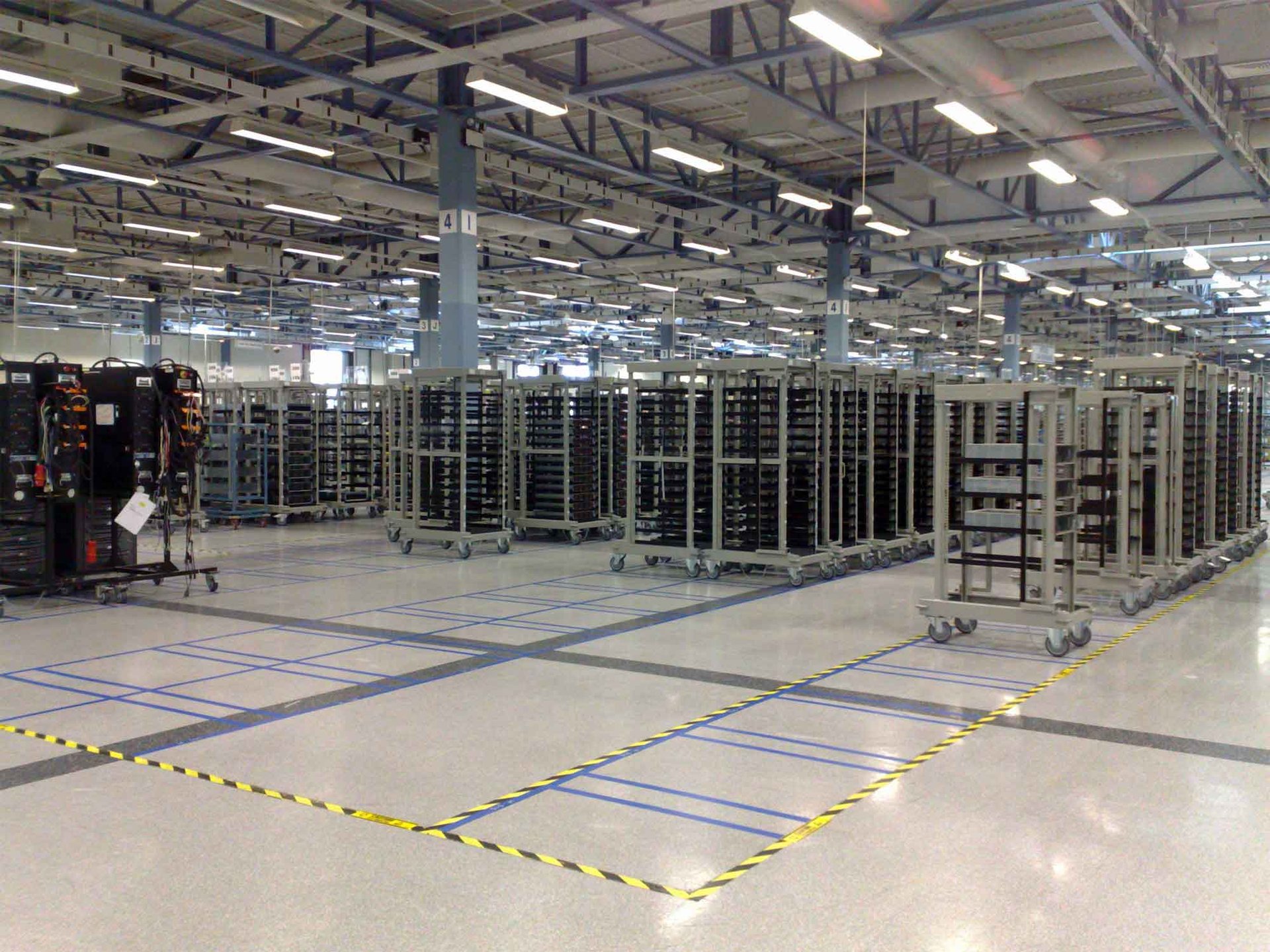 Server trolleys with location positions Photograph showing server trolleys in a large warehouse with marked location positions