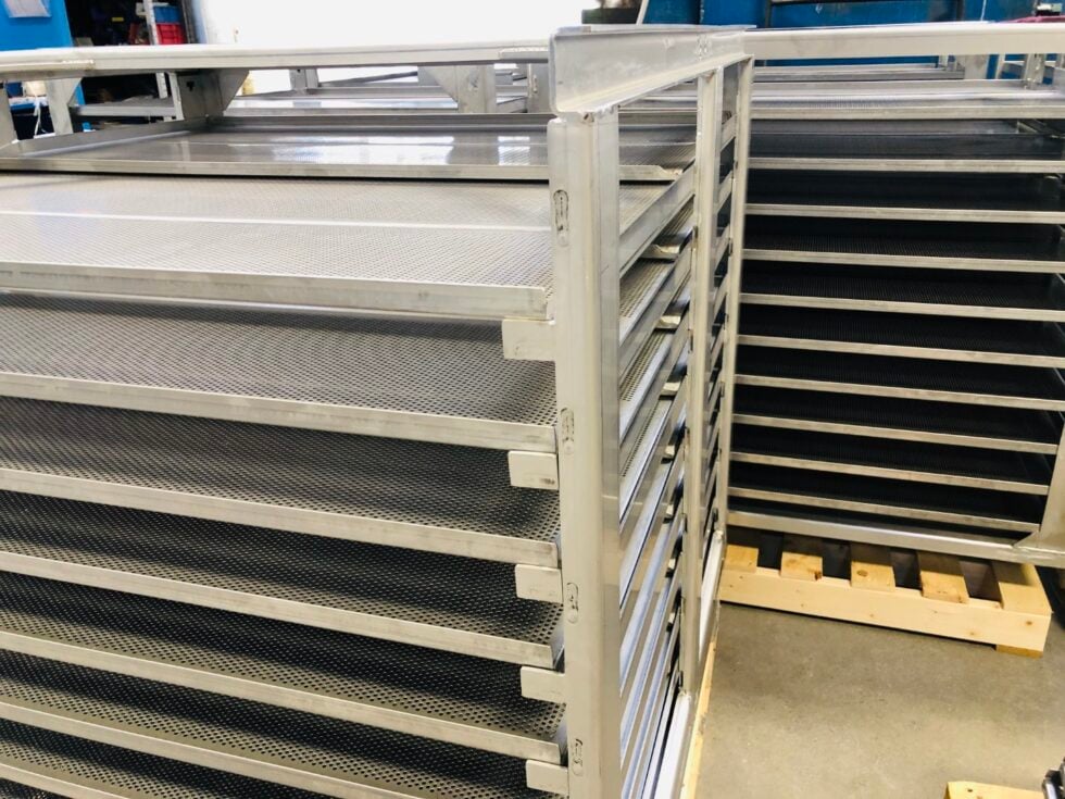 Manual loading sterilization trays in frame
