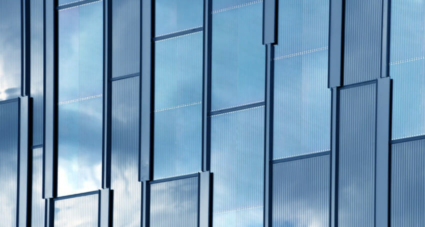 A building with photovoltaic glazing and blue glass windows.