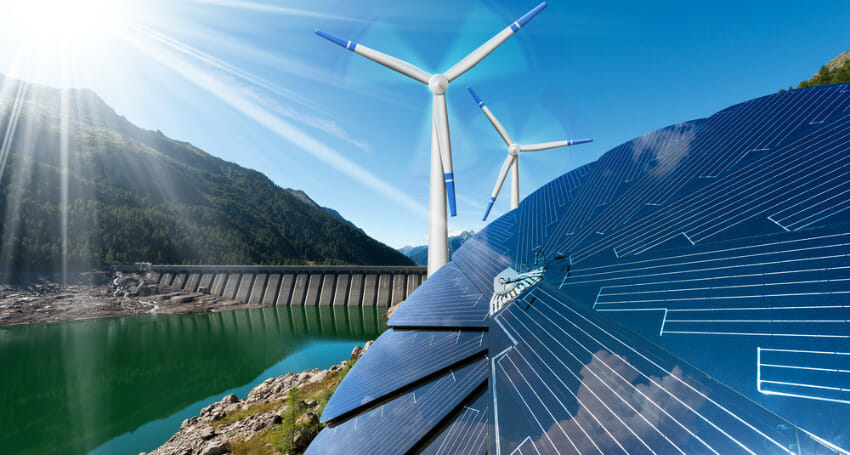 Solar panels, wind turbines, and a hydroelectric dam are shown in a scenic mountain landscape under a clear blue sky, representing renewable energy sources.
