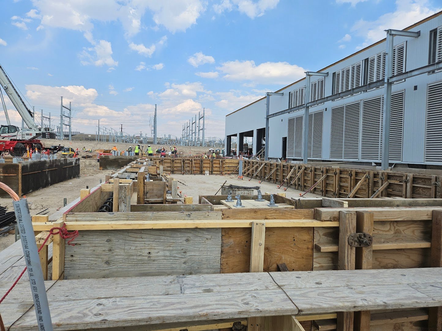 Data center construction site in Wyoming showing structural foundations and civil engineering work for 50MW mission-critical facility
