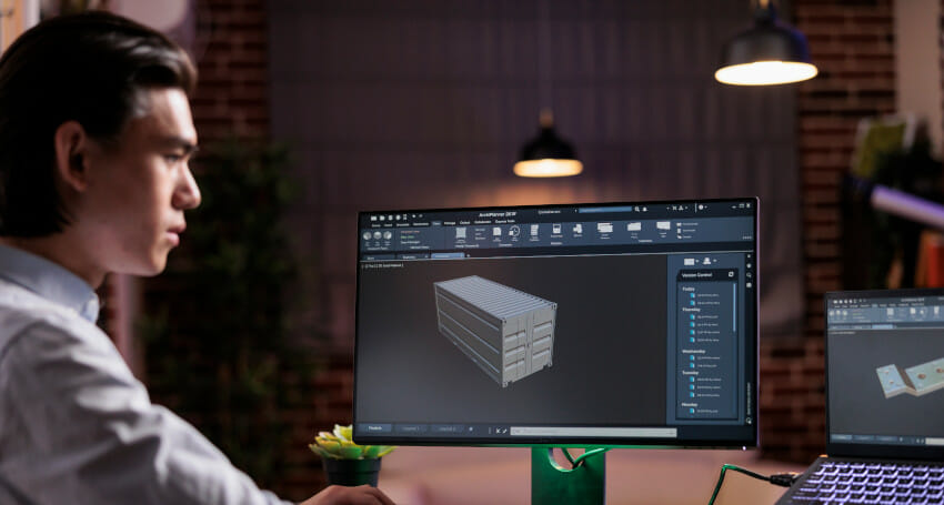 A civil engineer is using computer tools.