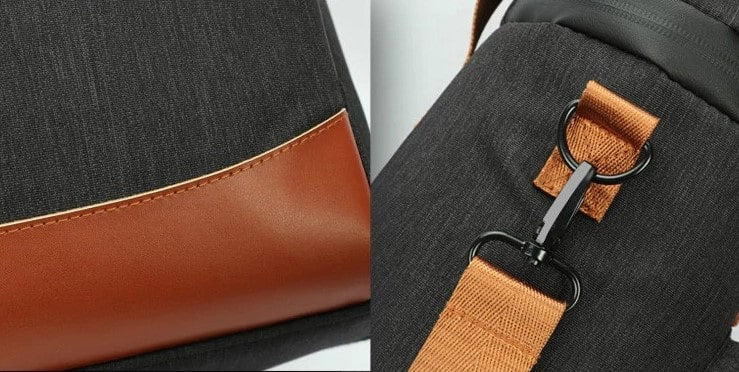 sac isotherme en tissu noir avec finition en simili cuir marron, équipé d'une sangle réglable et d'un clip de fixation, idéal pour le transport de repas ou de boissons.