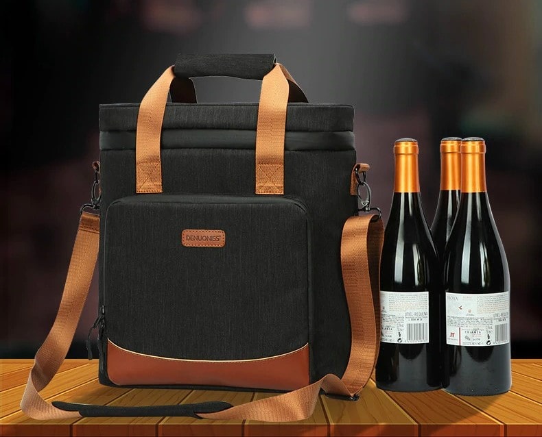 Sac isotherme noir avec anses et bandoulière, conçu pour le transport de bouteilles, idéal pour les pique-niques et les sorties.