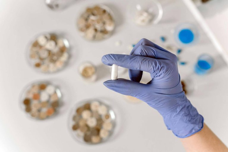 Types of medicines layed down in glass containers