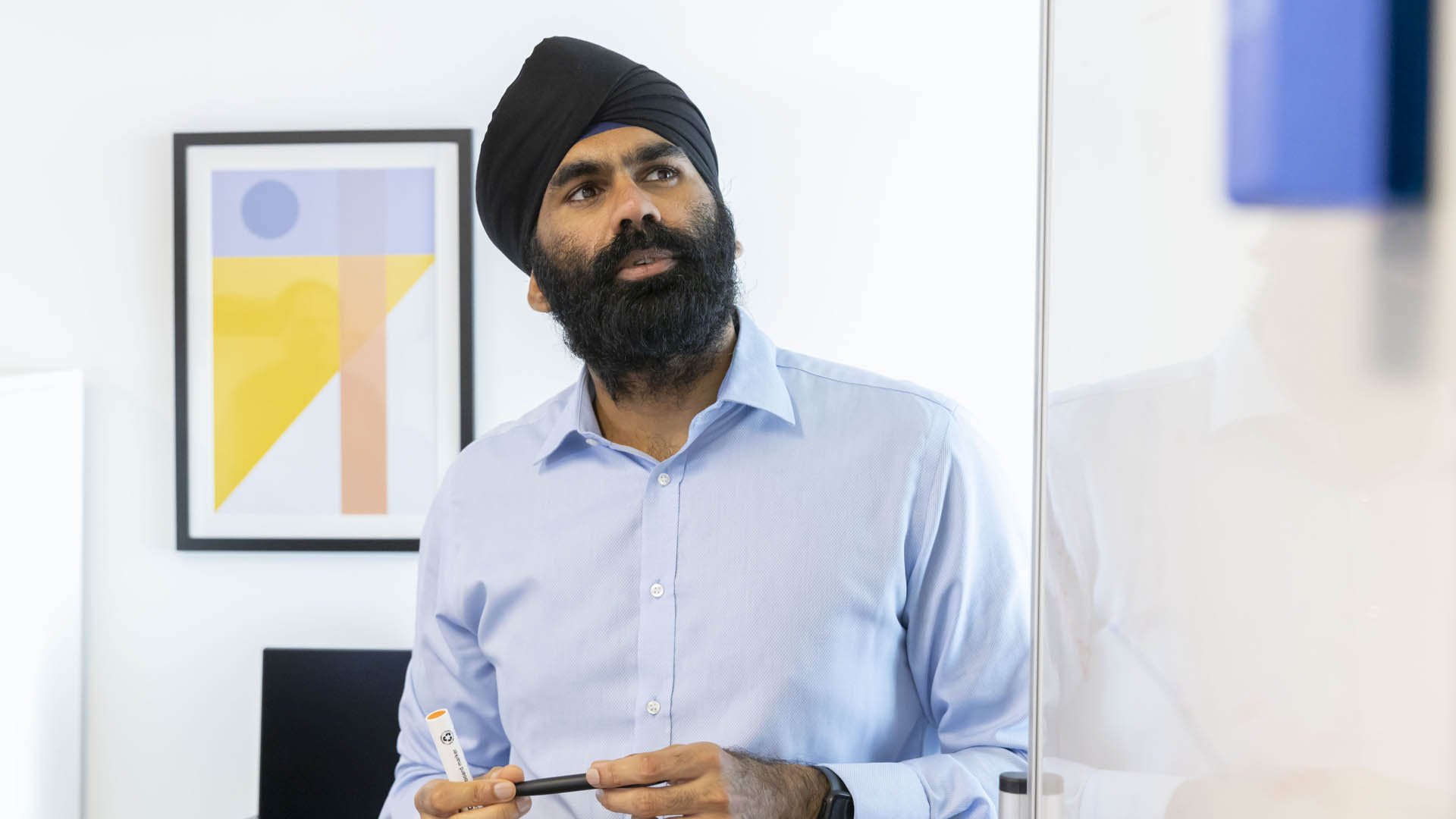 A man wearing a turban talking