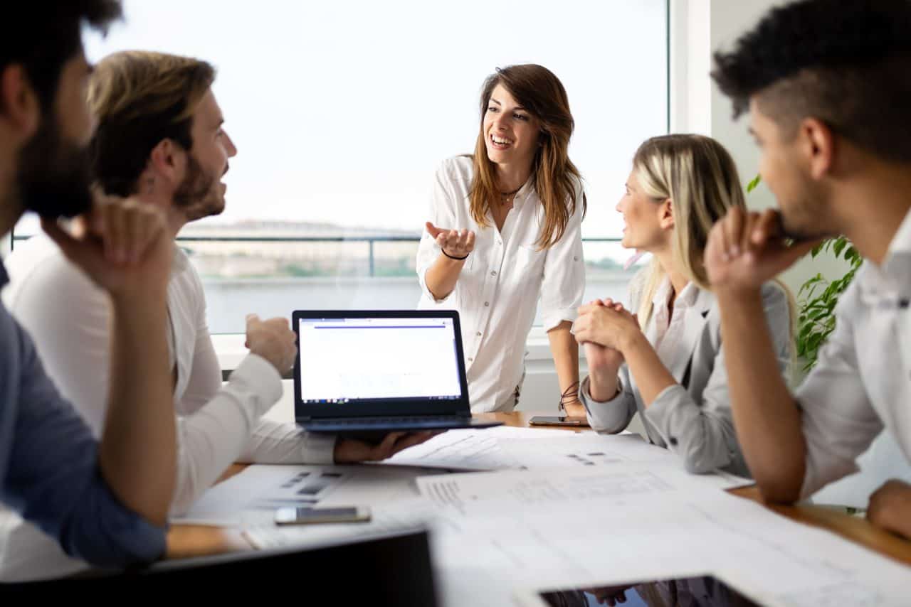 IT Consulting Management team meeting in bright conference room