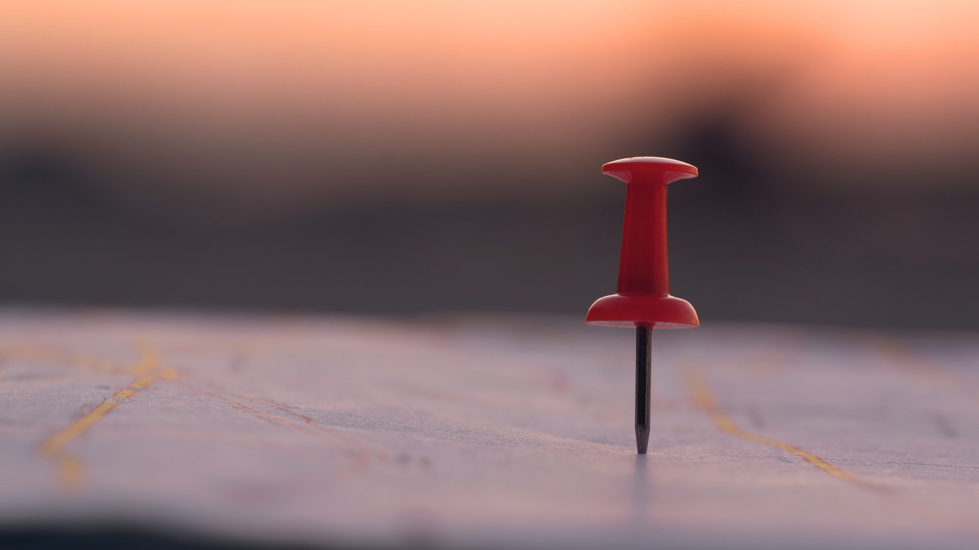 Red pin marking a location on a map, representing Google Maps Optimization Services.