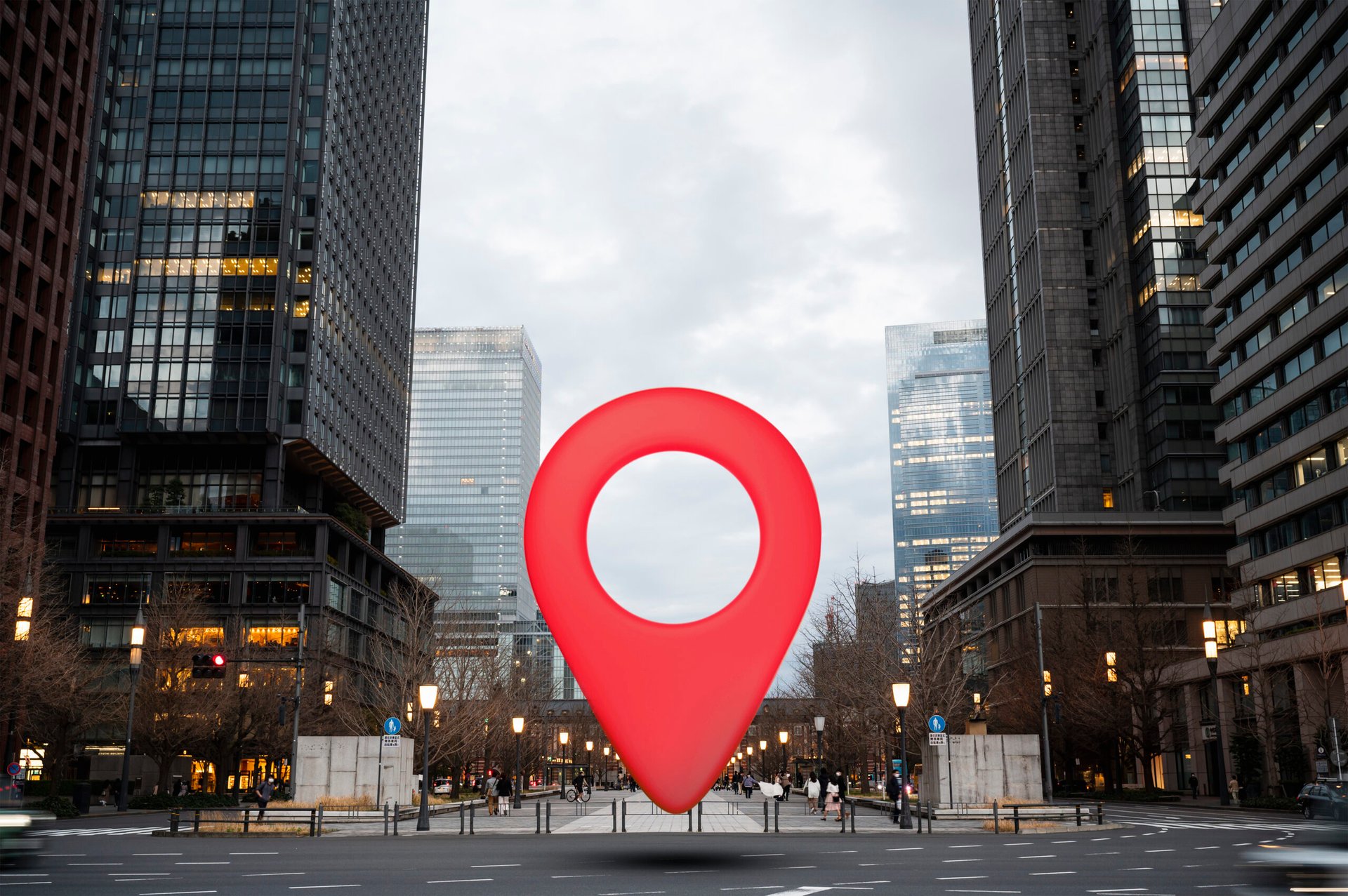 Red location pin placed in the middle of a cityscape, representing Local SEO.