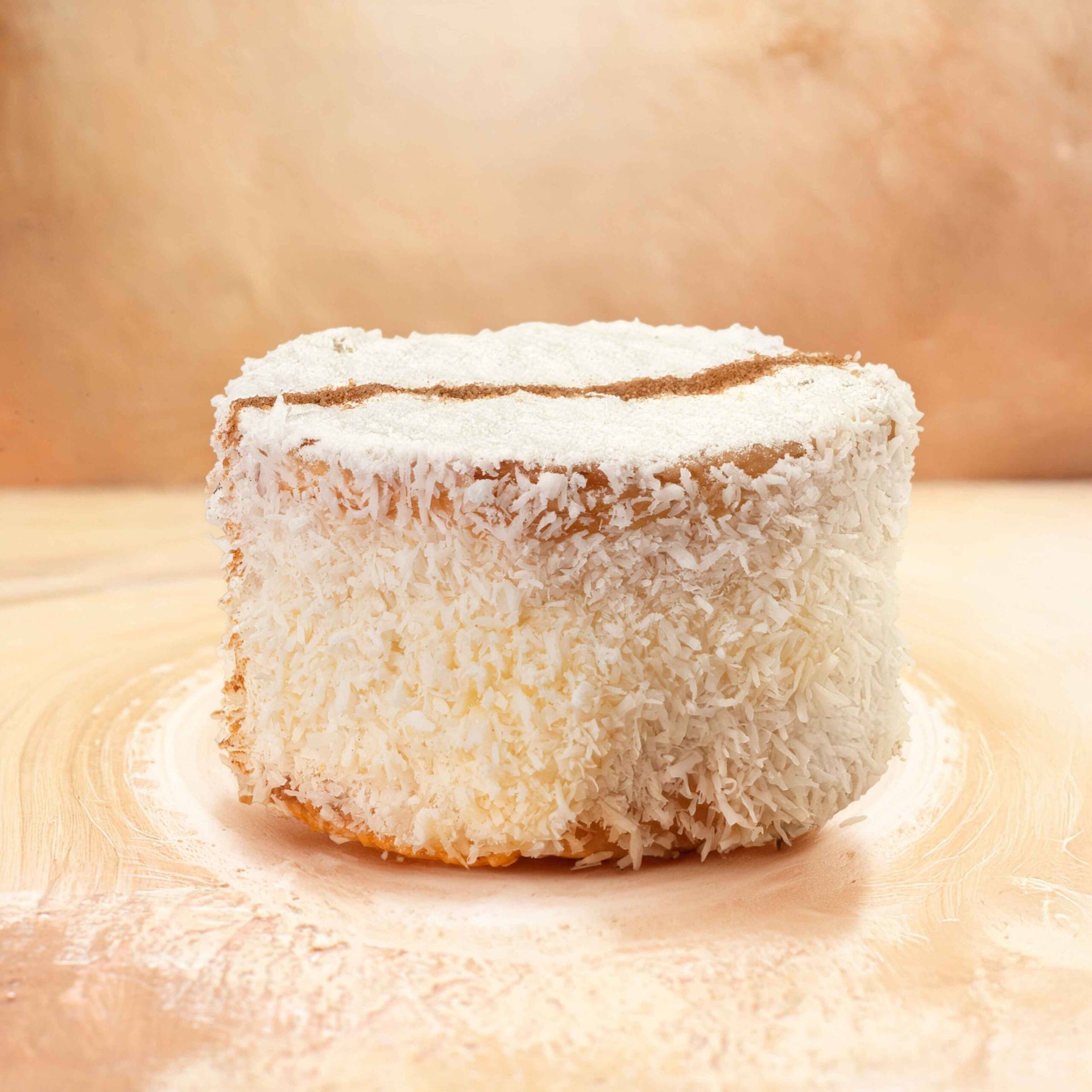 Vertical view of freshly baked soft cake with fruits on mixed color background