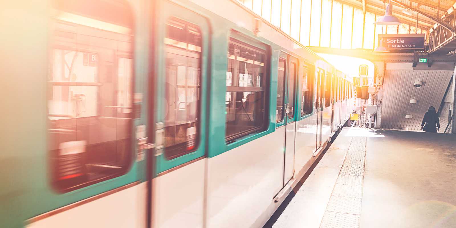 This image shows a Paris Metro subway train at station, the best way to reach the Latin Quarter from Gare du Nord.