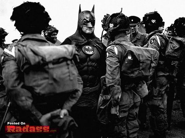 A black and white photo featuring soldiers alongside Batman, showcasing superheroes throughout history.