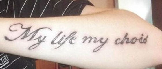 A man with a tattoo that says my life, empowering others with body art.