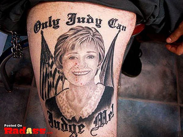 A tattoo depicting a woman with repetitive images, questioning the permanence of the art form.