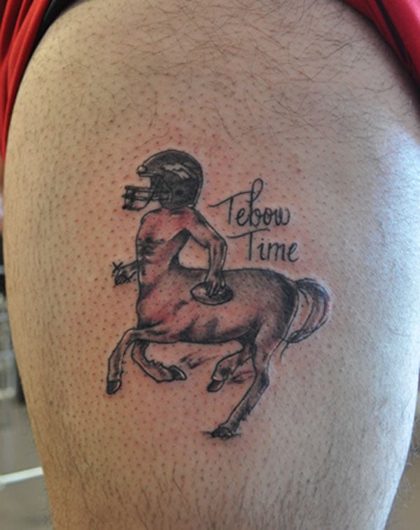 A man with a horse tattoo.
