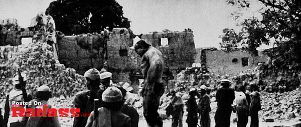 Superheroes standing in front of black and white ruins.