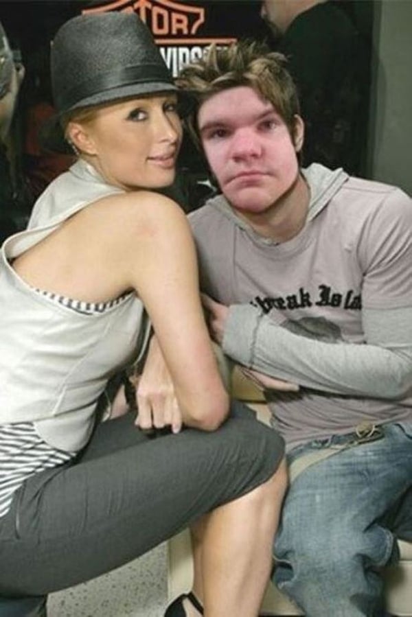 A man and a woman posing for a picture with killer photoshop skills.