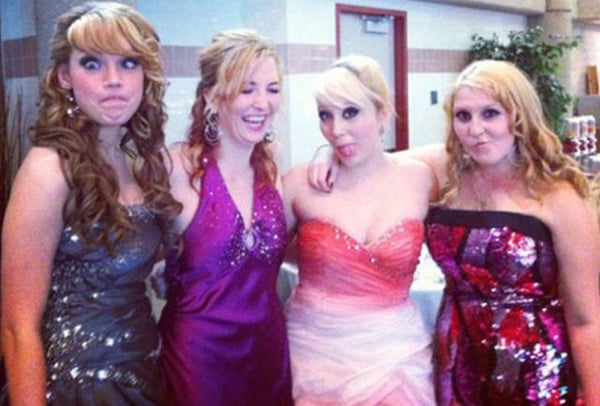 A group of women in formal dresses posing for a photo that captures the essence of