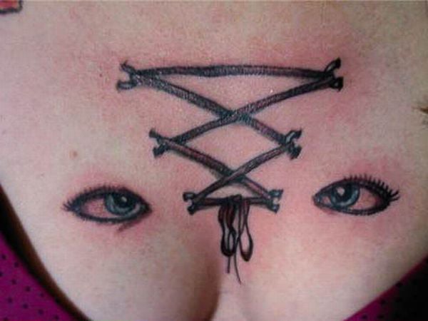 A woman's chest adorned with lace tattoos to uplift and empower her.