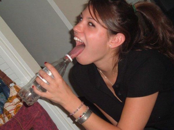 Keywords: licking, water bottle
Modified Description: A girl is sensually licking a water bottle.