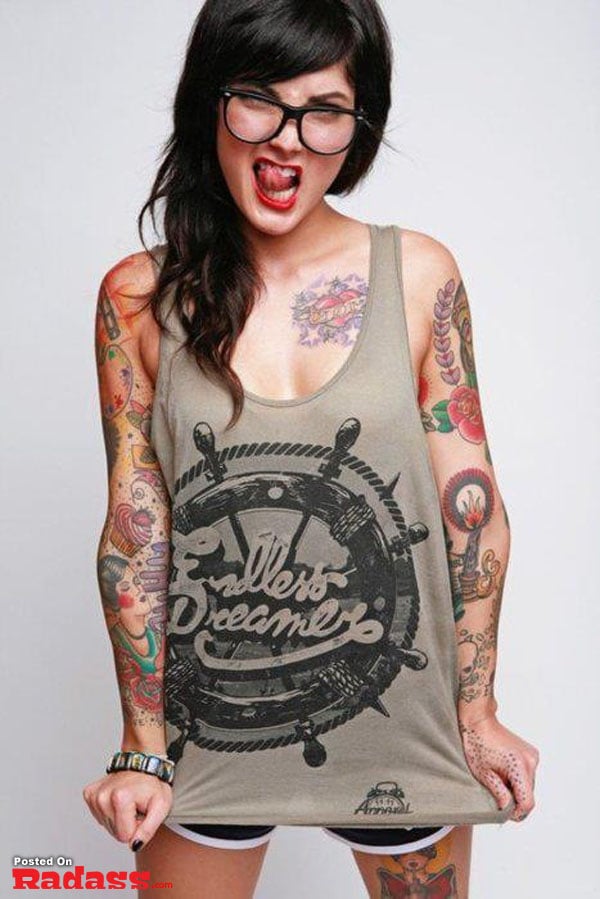 hot girls with tattoos-40 Insane Tattoos by Benjamin Blaukis featuring a woman with a rose and skull on her thigh.