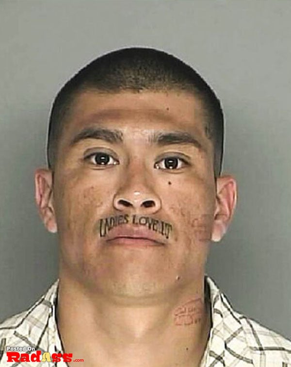 A man with a permanent face tattoo.