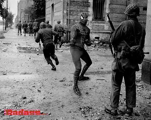 Superheroes in action, running through a street.