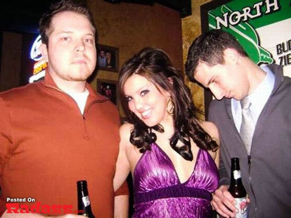 A group of people posing for a picture in a bar, showcasing the widespread popularity of social gatherings.