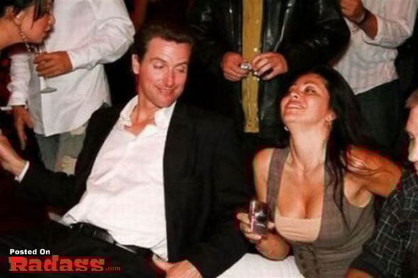 A group of people at a party with a man and a woman, exploring the widespread popularity of boobs.