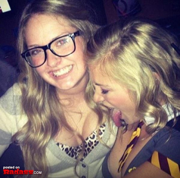 Two girls with glasses posing for a picture, showing their stylish eyewear.