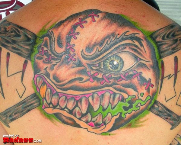 A woman in a blue dress posing next to a magazine cover featuring Pop Stars of the 90’s and What They Look Like Today.