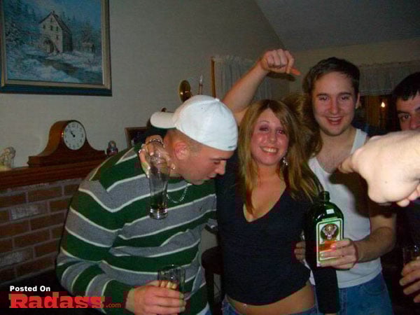 A group of people posing with a bottle of alcohol in Did You See That?
