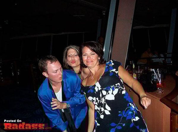 A group of people posing for a picture in a popular bar.