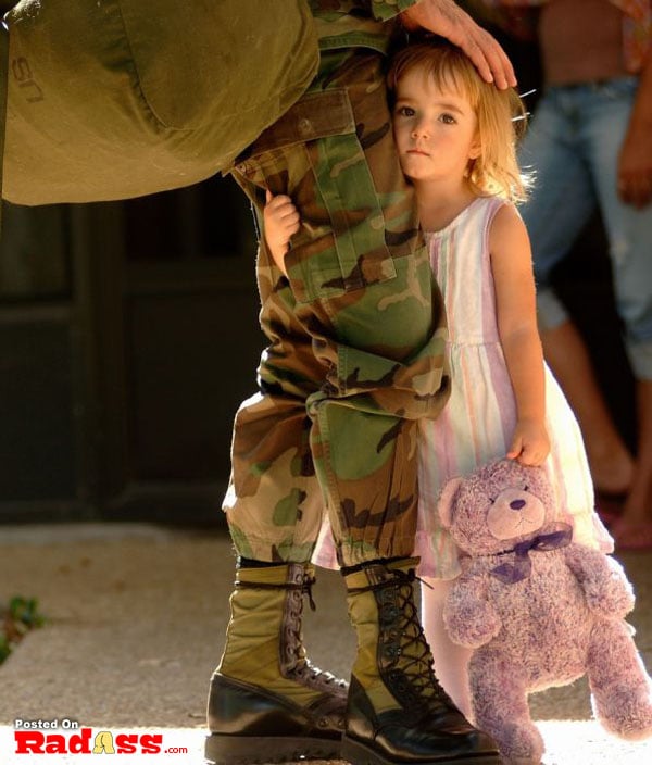 A young American girl holding a teddy bear.