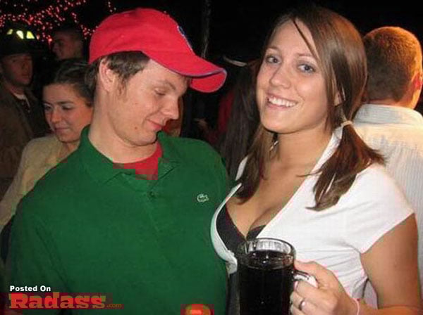 A man and a woman standing next to each other at a party, providing insight into social gatherings.