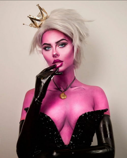 A woman with pink makeup wearing a crown during A Visit to Azzyland.